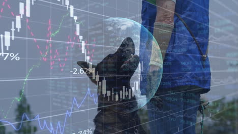 black dog looking up while owner holding leash and stock charts overlaying globe motif backdrop