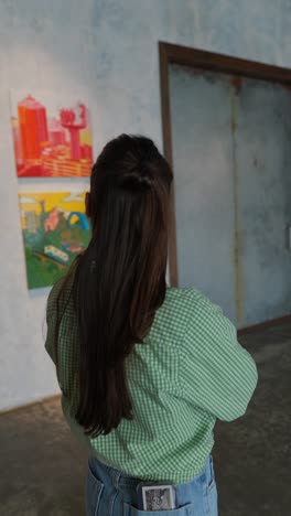 woman viewing art in an art gallery