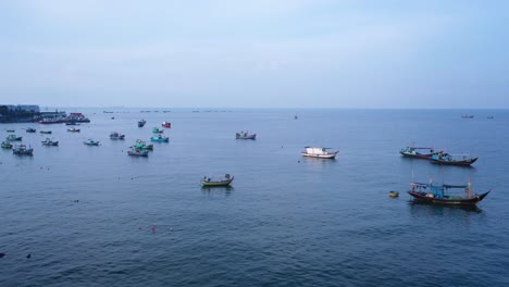 Long-aerial-reveal-of-fishing-boats-anchored-around-the-marina-at-Vung-Tau-in-Vietnam