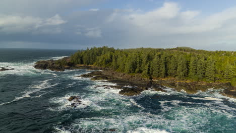 drone video at sunset in ucluelet british columbia, canada over the ocean and forest