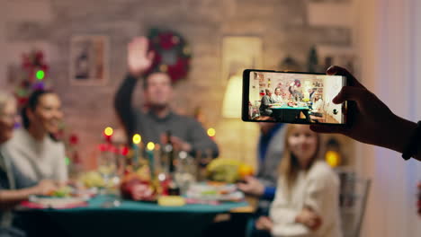 girl taking photos of her family using smartphone