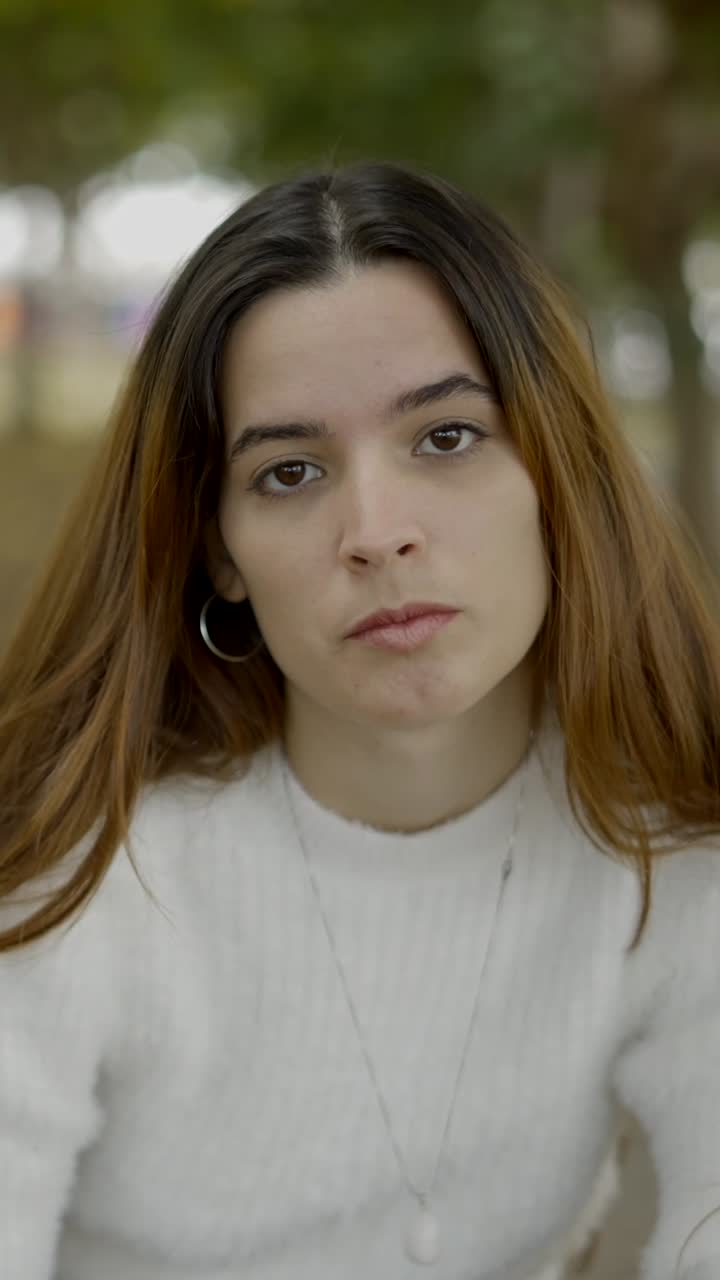 Close-up Portrait of a Young Woman with Long Brown Hair
