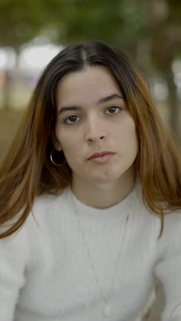 close-up portrait of a young woman with long brown hair