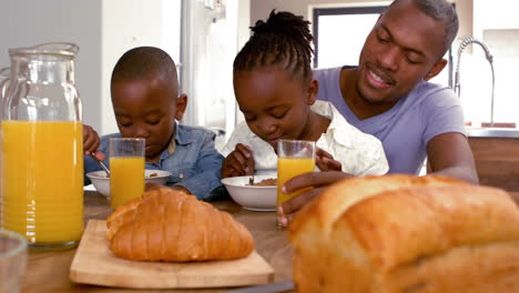 happy family having breakfast together in the morning