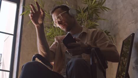 handicapped man listening to music