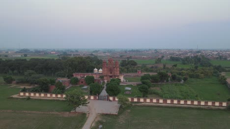 drone view of gurdwara rori sahib located in a small village called eminabad in punjab, pakistan