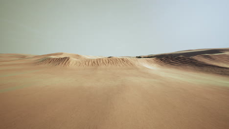 beautiful sunset over sand dunes of sahara desert in morocco