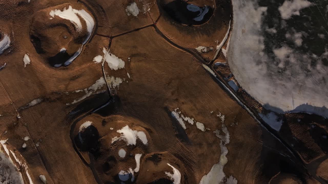 Volcanic craters and snowy terrain near lake mývatn, iceland, aerial view