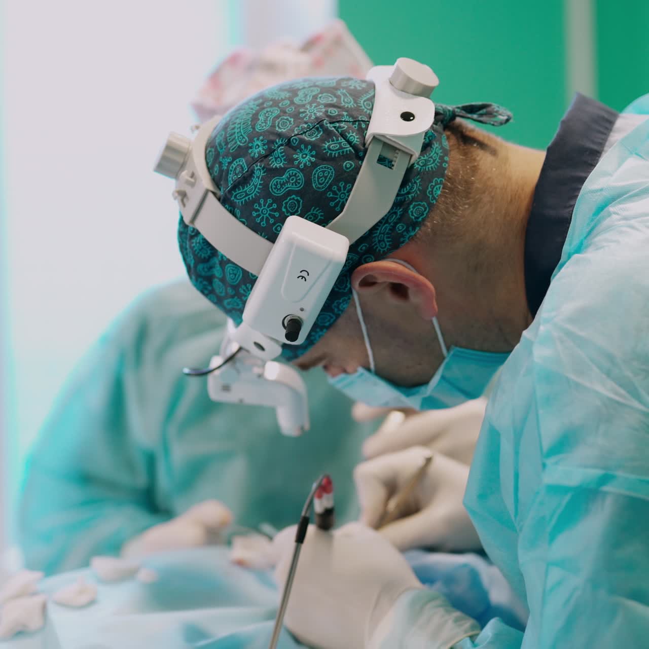 Team surgeon at work in operating room. Surgery otoplasty. Auricle correction