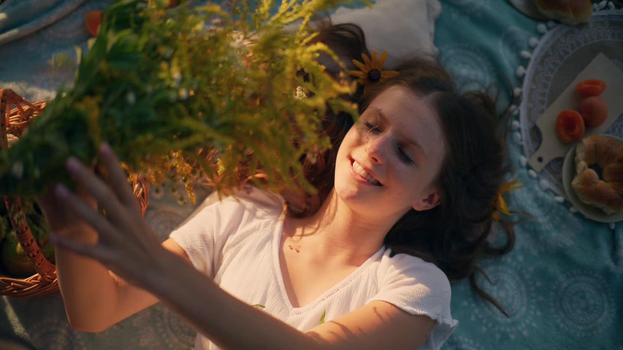 Tranquil girl on blanket in warm sunshine