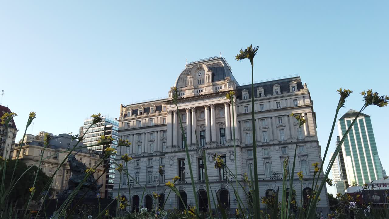 Panoramic at Kirchner Cultural Center and Luna Park Theatre of Buenos Aires City Argentina over Spring flowers landscape