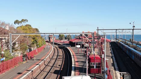 two trains passing by brighton beach station