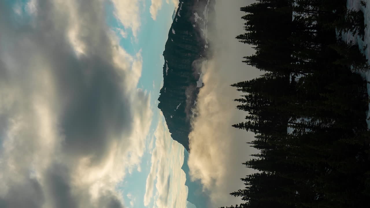 Vertical 4k Timelapse of Clouds and Fog Waves Above Mountain Peaks and Valley of Glacier National Park, Montana USA