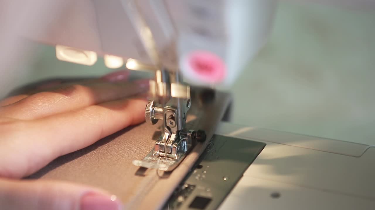 Seamstress Sews Clothes. Creative young fashion design using sewing machine, making clothes