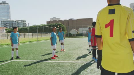 african american kid in blue scoring in a sunny day