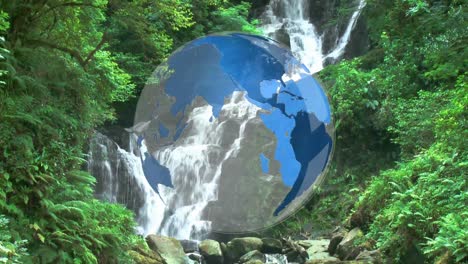 rotating globe in front of water falls