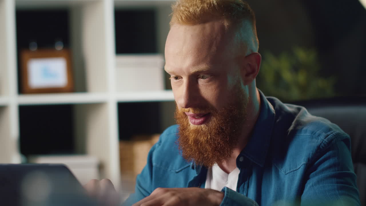 Hipster man browsing computer at work