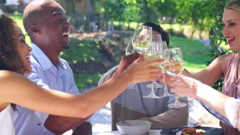 Friends-toasting-glasses-of-wine-at-restaurant