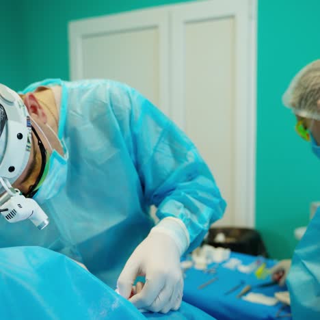 surgeon at work on operating
