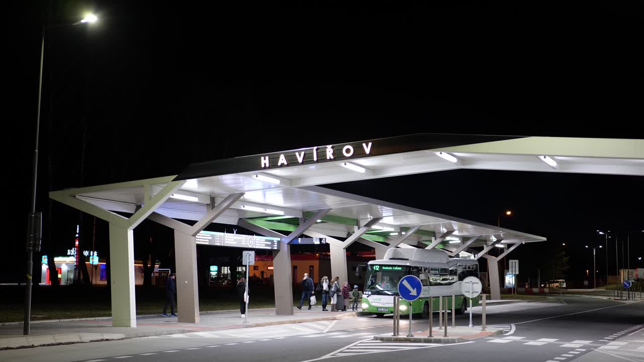 SOR BN12 CNG intercity bus of Transdev company at Havirov train station at night, Czech Republic