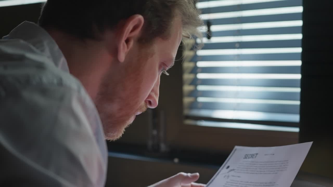 Businessman, agent, or investigator reviewing a secret file, marking key details with a red marker. Over-the-shoulder shot. Investigation, intelligence, classified information, or corporate intrigue.