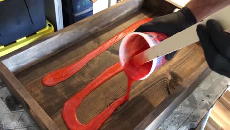 mixing and pouring epoxy resin to pour into a mold