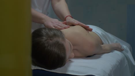 woman receiving a back massage