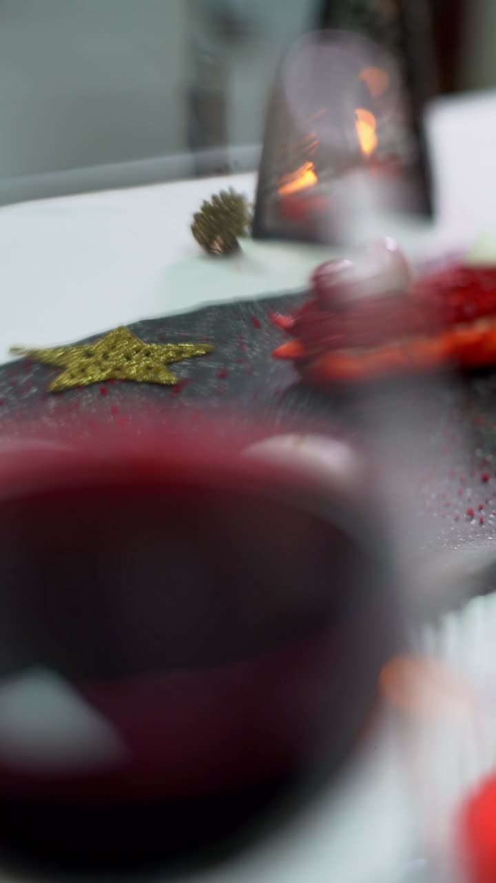 A woman lights a candle for a romantic sit, close up shot, insert shot
