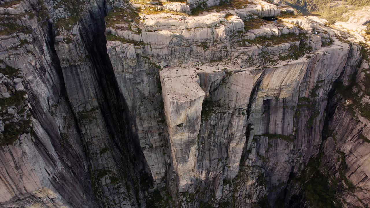 Iconic Preikestolen, Norway. Captured from above, vast fjord landscape and sunlit mountain peaks.