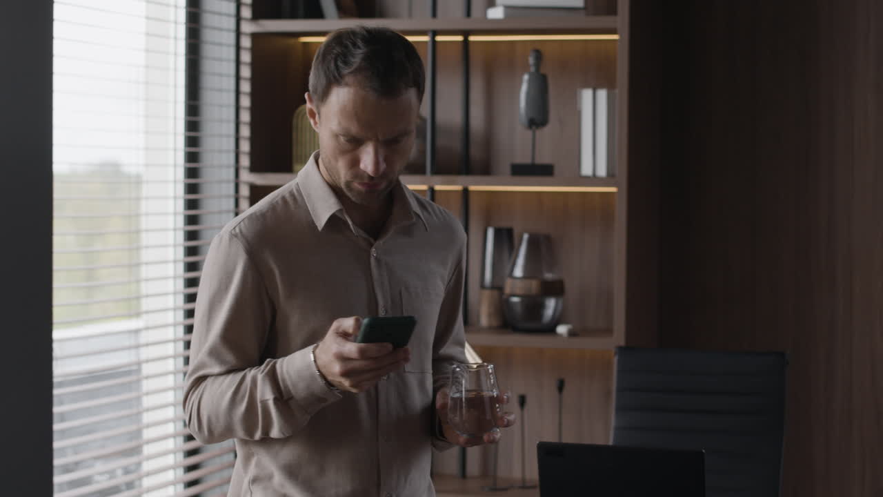 Man using smartphone in office