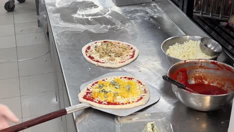 chef is making pizza with dough flour vegetables sauce cheese beef meat chicken and mushroom it should be delicious and i miss its good spicy taste in reasonable price not expensive in doha qatar