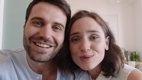 happy couple video chatting using webcam waving at baby smiling excited enjoying online communication