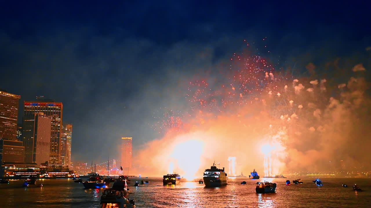 Stunning show with amazing fireworks over the East River in New York, USA. Multiple boats are standing on the river