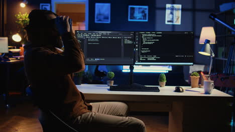 it expert wearing high tech virtual reality headset to visualize lines of code