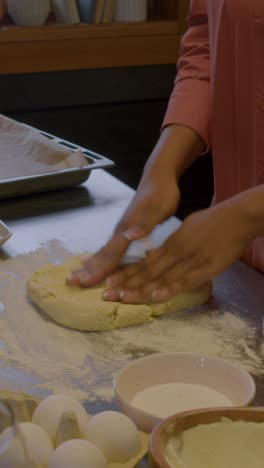 woman kneading dough