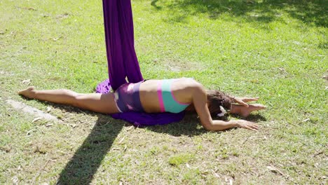 supple gymnastic young woman doing the splits