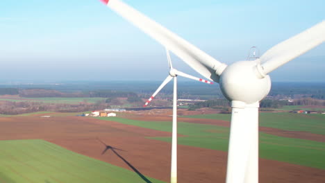 Wind-turbine-blades-spinning-aerial-close-up