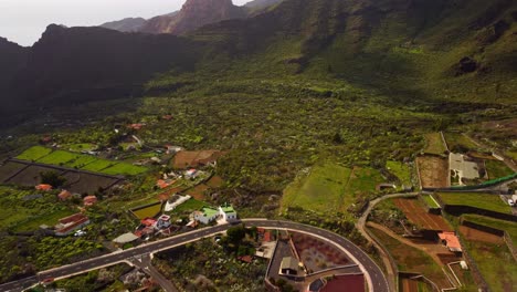Beautiful-valley-with-road-and-buildings-in-Santiago-del-Teide,-Tenerife,-aerial