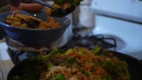 a delicious bowl of pasta and stir fried rice with veggies, a perfect meal for an active lifestyle - slow motion