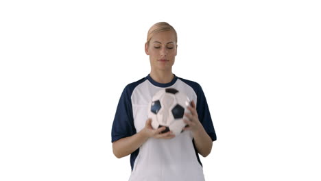woman juggling a soccer ball