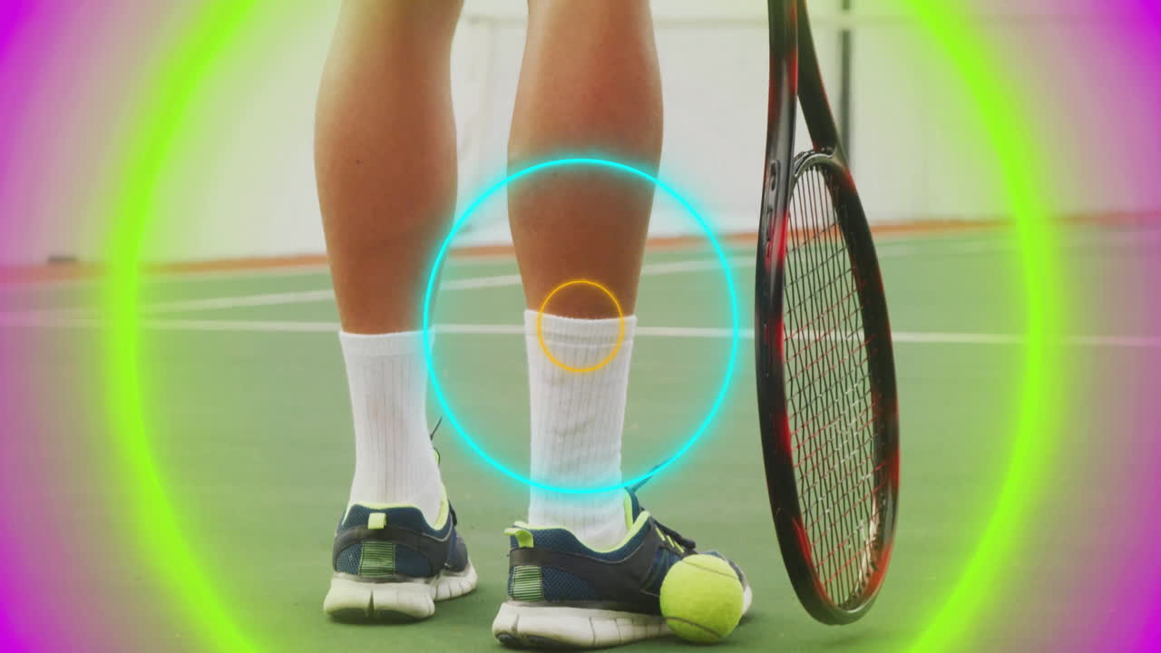 Tennis player legs standing on sports hardcourt, showing neon ring overlays and tennis ball