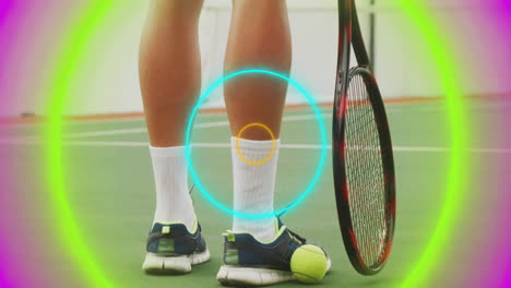 tennis player legs standing on sports hardcourt, showing neon ring overlays and tennis ball