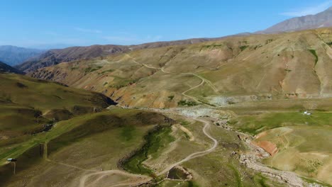 Aerial-View-Of-Valley,-Mountain-And-Hiking-Trails-On-A-Sunny-Day-In-Uzbekistan