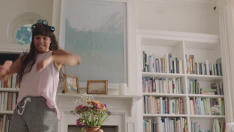 happy young woman dancing at home having fun celebrating weekend morning with funky dance moves enjoying freedom 4k footage