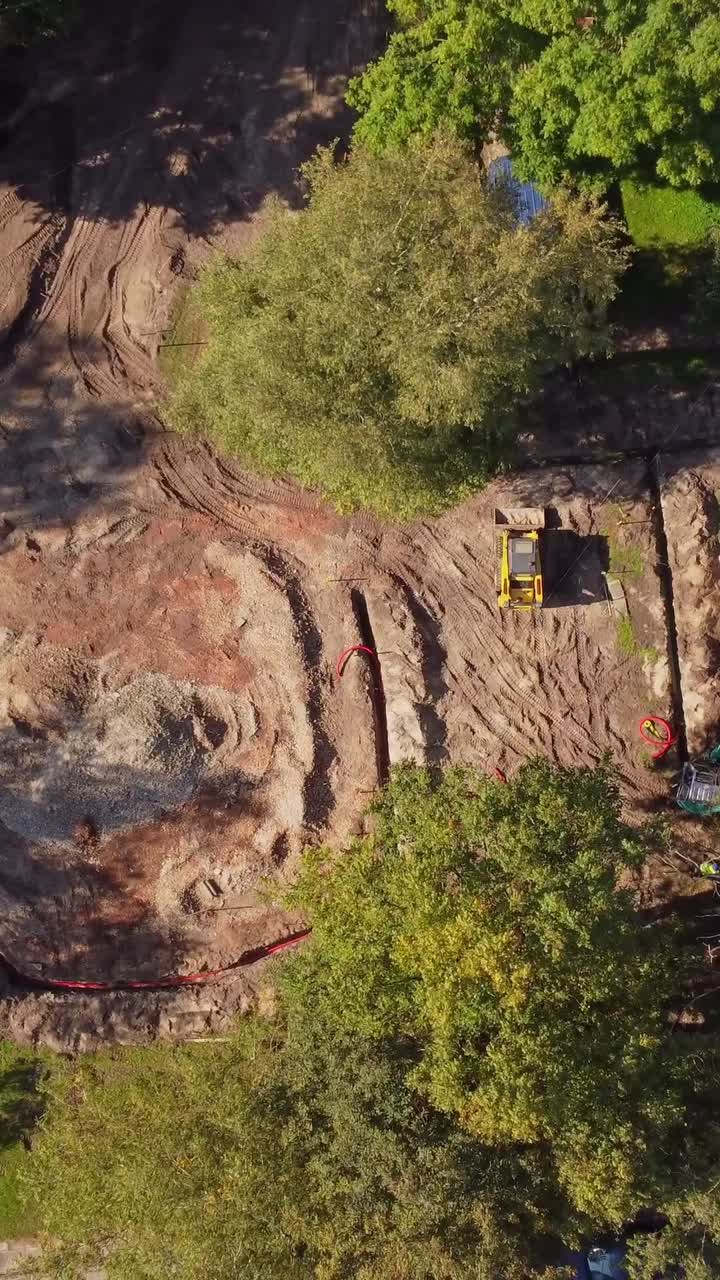 Riga Construction: Aerial View of Groundwork and Excavator on Site