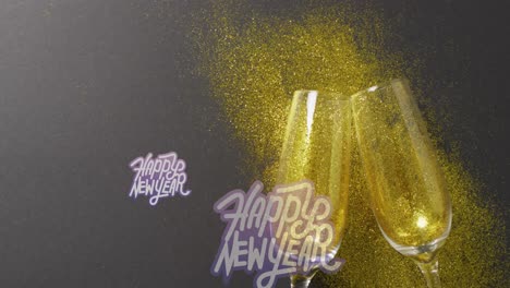 animation of happy new year text over champagne glasses