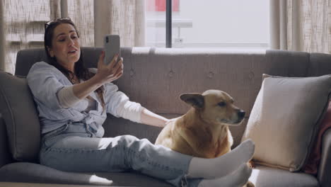 happy young woman using her smartphone for a video