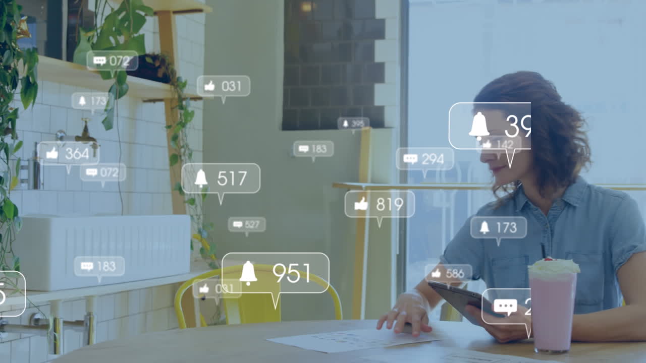 Animation of media icons over caucasian woman using tablet