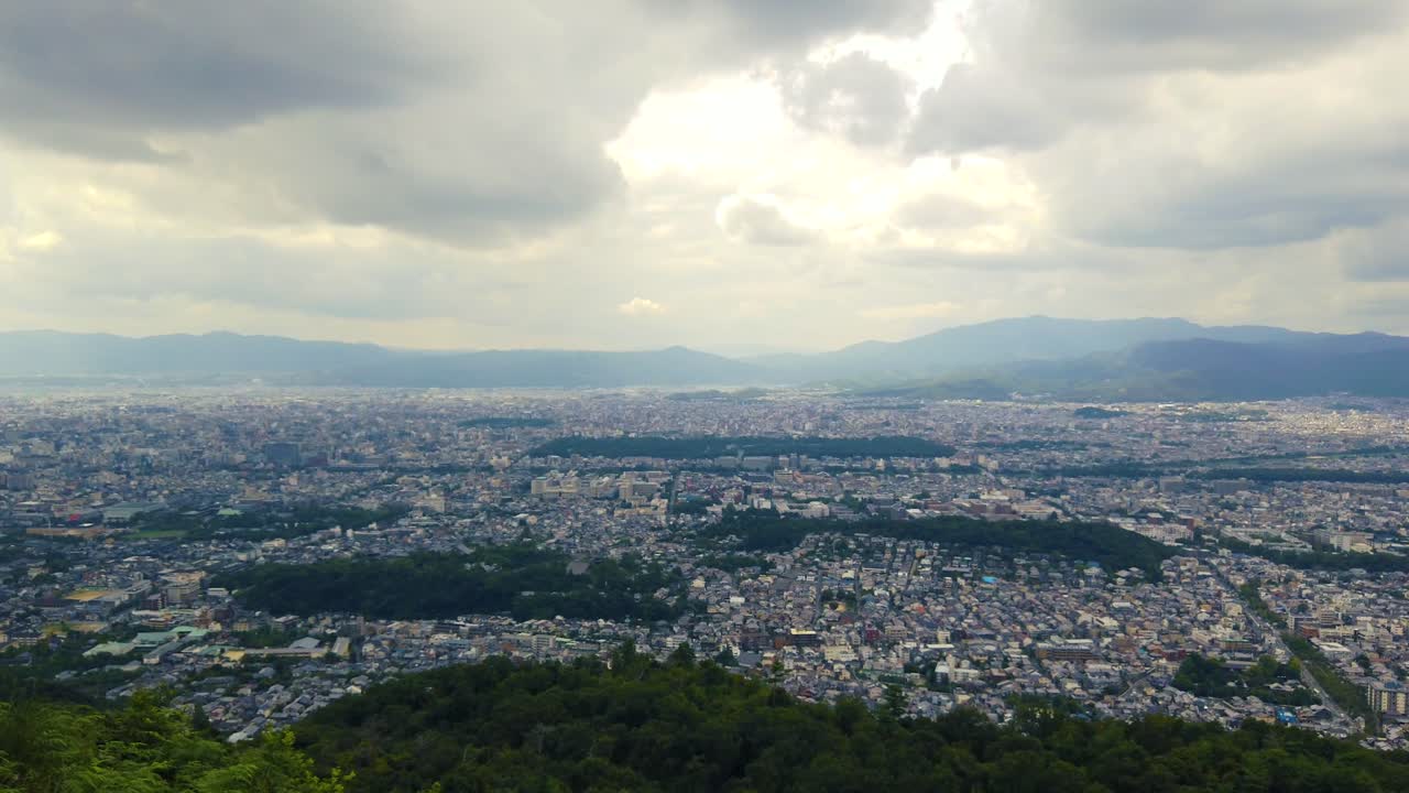 Aerial drone fly city of Kyoto Japan, Panoramic town, mountain skyline landscape