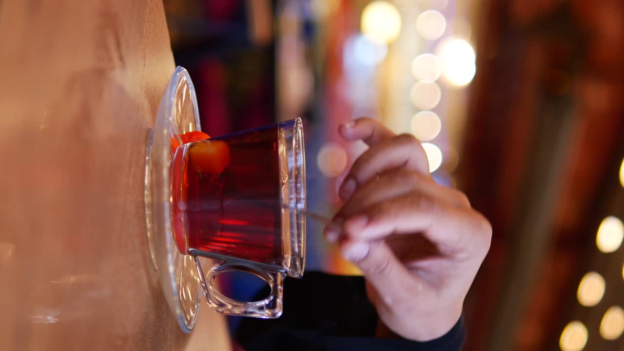 Person Drinking Tea in a Cafe